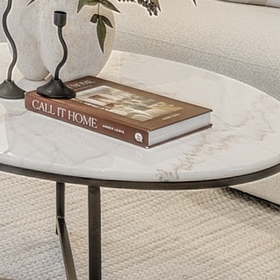 The coffee table at 100%: candlesticks, the printed book title, marble veining and the rug below, straight from the delivered file