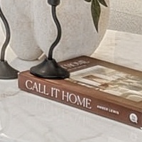 The same spot at 200%: the candlesticks and the printed title and author line on the book
